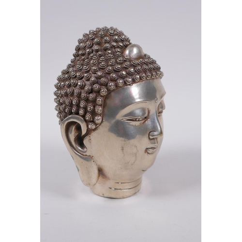 173 - A Sino Tibetan filled white metal Buddha head, impressed 4 character mark to base, 16cm high