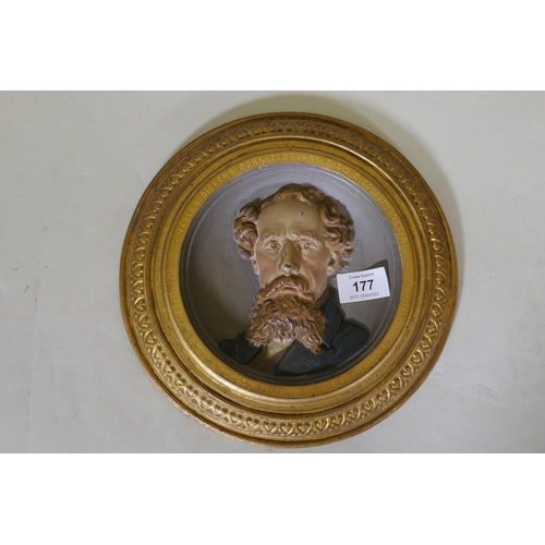 177 - A C19th cold painted and gilt commemorative plaque depicting a bust portrait of Charles Dickens, mod... 