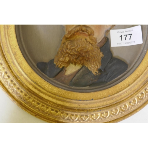 177 - A C19th cold painted and gilt commemorative plaque depicting a bust portrait of Charles Dickens, mod... 