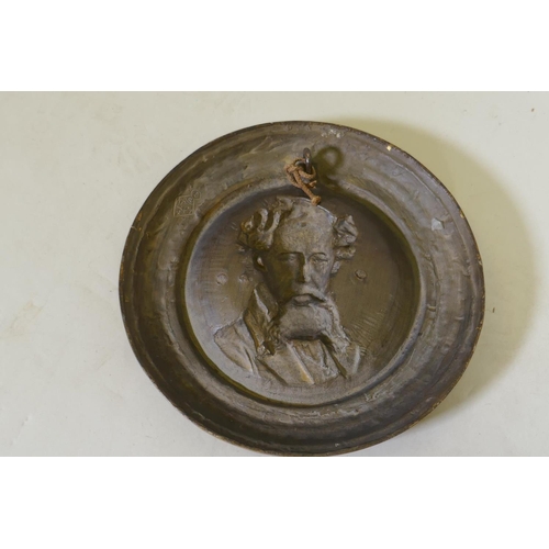 177 - A C19th cold painted and gilt commemorative plaque depicting a bust portrait of Charles Dickens, mod... 