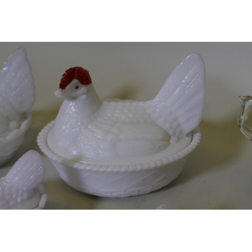 184 - Three Victorian slag glass egg crocks in the form of a hen on a basket, largest 12cm long