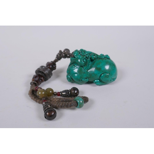 186 - A Chinese imitation turquoise kylin pendant/toggle, 7cm long