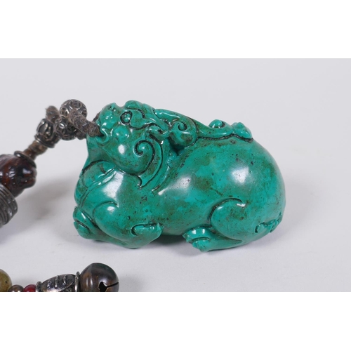 186 - A Chinese imitation turquoise kylin pendant/toggle, 7cm long