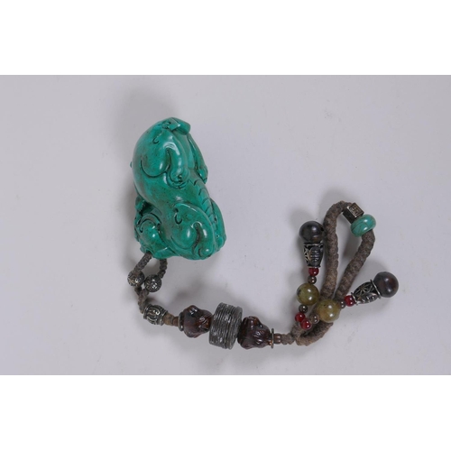 186 - A Chinese imitation turquoise kylin pendant/toggle, 7cm long