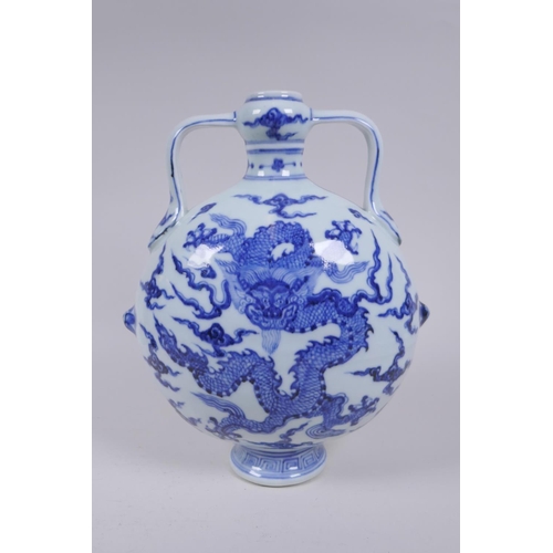 188 - A blue and white porcelain two handled moon flask with dragon decoration, Chinese Xuande 6 character... 