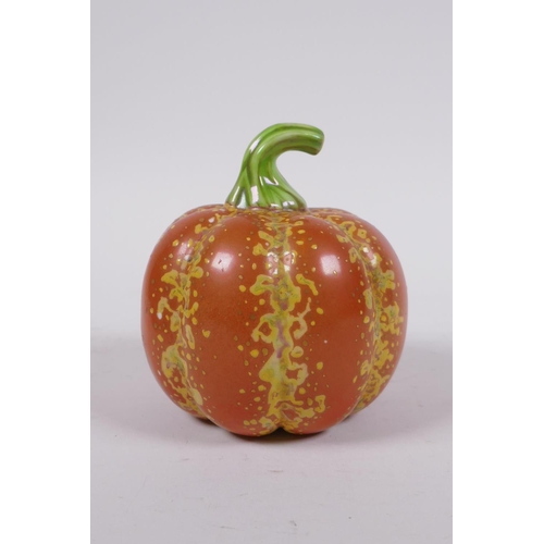 19 - A Chinese polychrome porcelain pumpkin, gold Qianlong seal mark to base, 10cm high, 10cm diameter