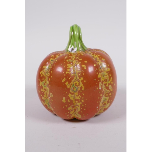 19 - A Chinese polychrome porcelain pumpkin, gold Qianlong seal mark to base, 10cm high, 10cm diameter