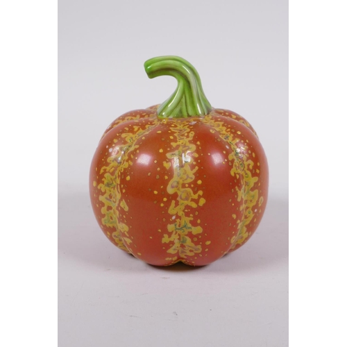 19 - A Chinese polychrome porcelain pumpkin, gold Qianlong seal mark to base, 10cm high, 10cm diameter