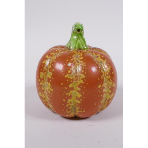 19 - A Chinese polychrome porcelain pumpkin, gold Qianlong seal mark to base, 10cm high, 10cm diameter