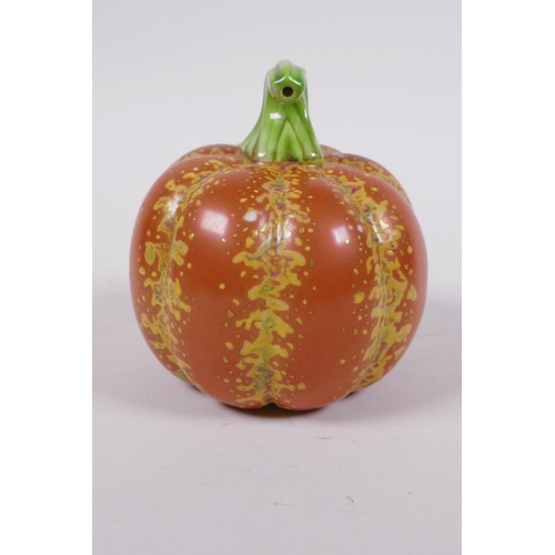 19 - A Chinese polychrome porcelain pumpkin, gold Qianlong seal mark to base, 10cm high, 10cm diameter