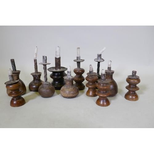 191 - A collection of wood candlestick, largest 17cm high