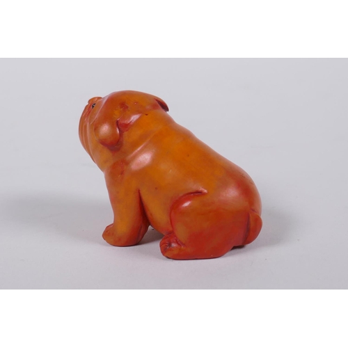 193 - A Japanese carved boxwood netsuke in the form of a puppy, mark to base, 6cm long