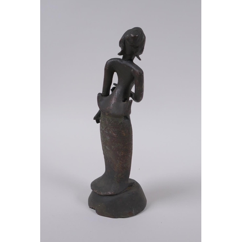 20 - An antique Burmese bronze female figure, 21cm high