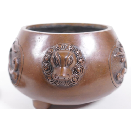 208 - A Chinese bronze censer and cover with two lion mask handles and stylised decorative dragon panels, ... 