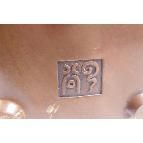 208 - A Chinese bronze censer and cover with two lion mask handles and stylised decorative dragon panels, ... 