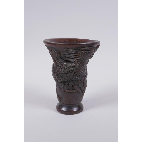 210 - A Chinese faux horn libation cup with raised phoenix  decoration, 13cm high