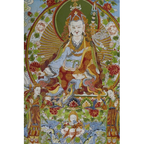 213 - A Tibetan gilt thread embroidered thangka, 62 x 91cm