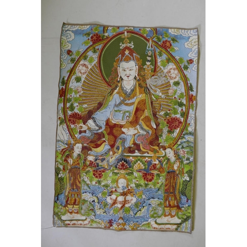 213 - A Tibetan gilt thread embroidered thangka, 62 x 91cm