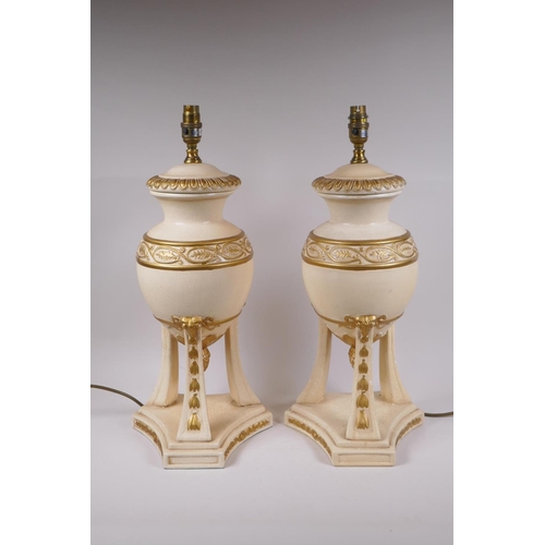 214 - A pair of painted ceramic urn shaped table lamps with gilt details, 52cm high