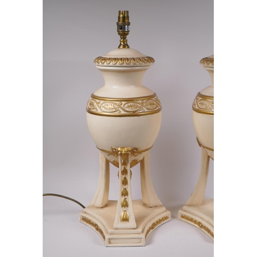 214 - A pair of painted ceramic urn shaped table lamps with gilt details, 52cm high