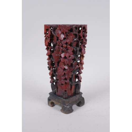 216 - A Chinese carved soapstone vase with pierced grape vine decoration, AF repair, 20cm high