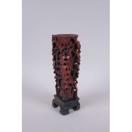 216 - A Chinese carved soapstone vase with pierced grape vine decoration, AF repair, 20cm high