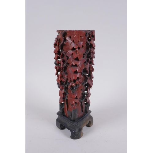 216 - A Chinese carved soapstone vase with pierced grape vine decoration, AF repair, 20cm high