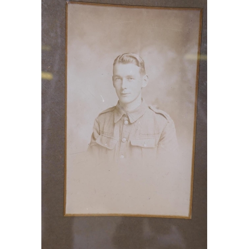 217 - Ten WWI silk postcards framed with a photograph portrait of a British soldier