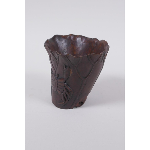 23 - An antique Chinese carved bamboo libation cup of lotus flower form with crab decoration, 8cm high