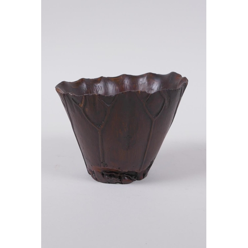 23 - An antique Chinese carved bamboo libation cup of lotus flower form with crab decoration, 8cm high