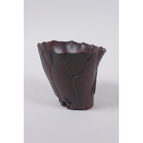 23 - An antique Chinese carved bamboo libation cup of lotus flower form with crab decoration, 8cm high