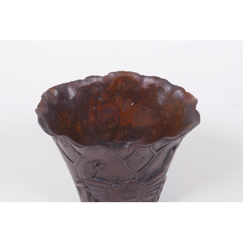 23 - An antique Chinese carved bamboo libation cup of lotus flower form with crab decoration, 8cm high