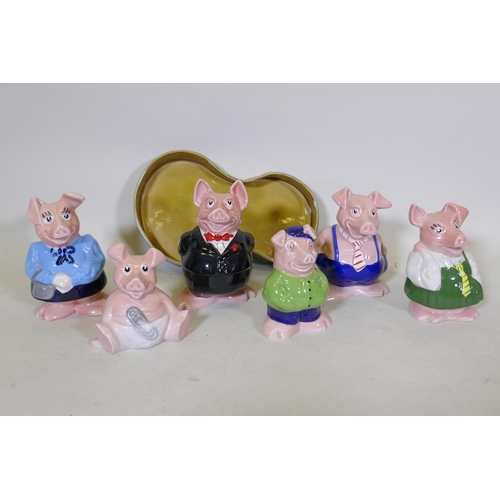 24 - A set of six Wade NatWest ceramic piggy banks, and a Beswick planter, 32cm long