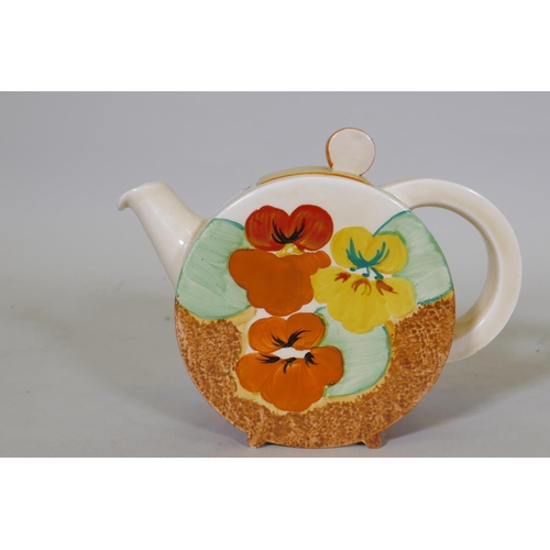 2 - A Clarice Cliff Bizarre Bonjour tea pot and cover, Pansies pattern, stamped to base, c.1933