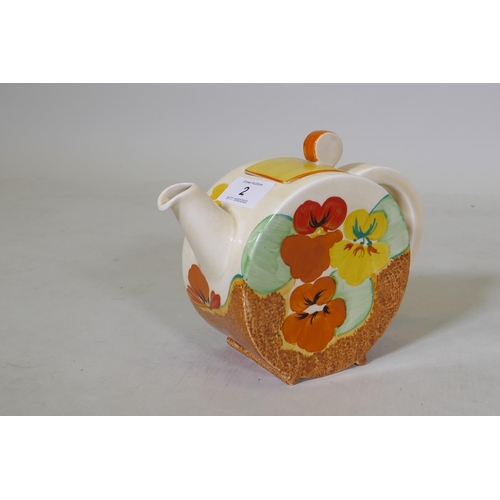 2 - A Clarice Cliff Bizarre Bonjour tea pot and cover, Pansies pattern, stamped to base, c.1933