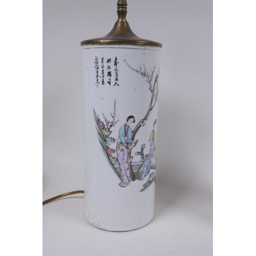 28 - A pair of Chinese Republic porcelain cylinder vases decorated with women of leisure in a garden, con... 