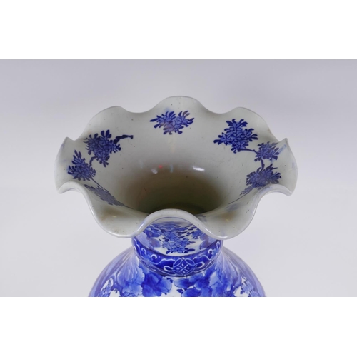 31 - A Japanese Meiji period blue and white porcelain vase with a frilled rim, decorated with geisha and ... 