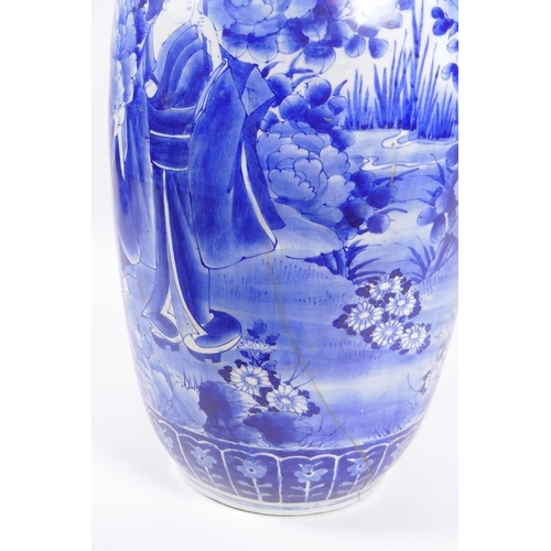 31 - A Japanese Meiji period blue and white porcelain vase with a frilled rim, decorated with geisha and ... 