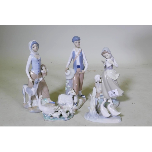 A Lladro figure of a girl with doves, 21cm high, a Lladro and Nao group ...