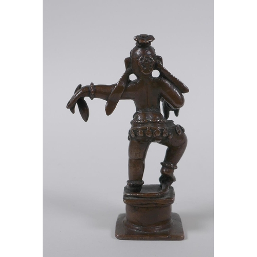 32 - An antique Indian bronze of a dancing figure, 10cm high