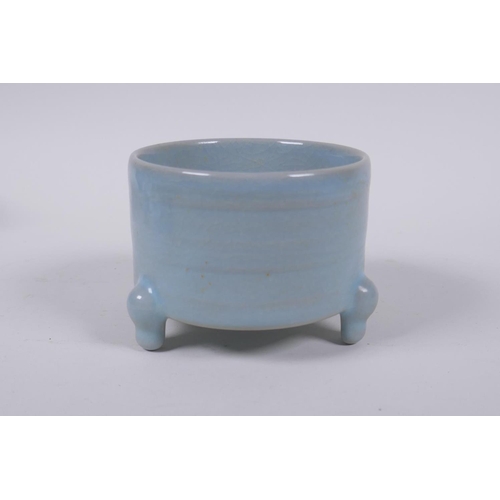 33 - A Chinese Ru ware style porcelain cylinder censer on tripod supports, 10cm diameter