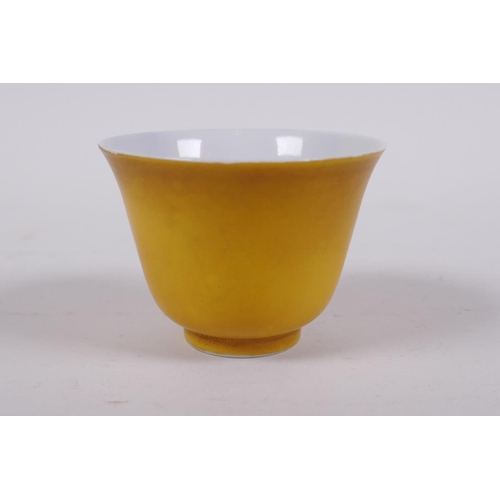 41 - A yellow ground porcelain tea bowl, Chinese KangXi 6 character mark to base, 5cm high x 7cm diameter