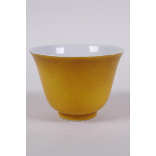 41 - A yellow ground porcelain tea bowl, Chinese KangXi 6 character mark to base, 5cm high x 7cm diameter