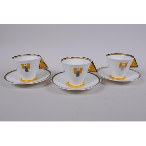 44 - Three 1930 Shelley Art Deco 'Vogue' shaped cup and saucers in the Yellow Blocks pattern, designed by... 