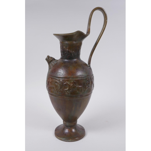 52 - A solid bronze ewer with cast Greco Roman style decoration, 35cm high