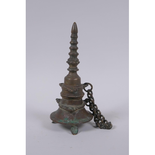 59 - A Tibetan bronze stupa, 18cm high