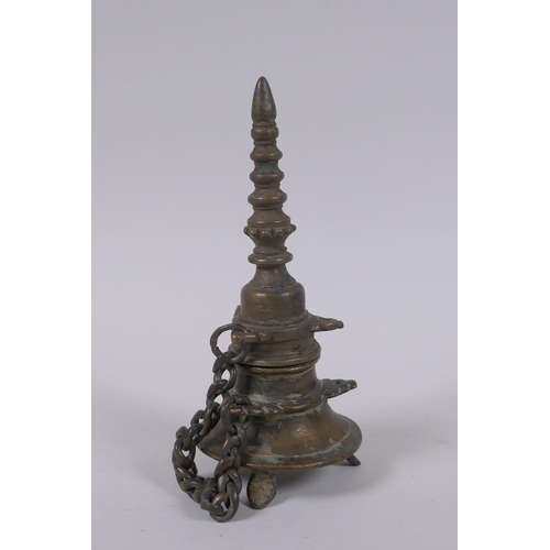 59 - A Tibetan bronze stupa, 18cm high