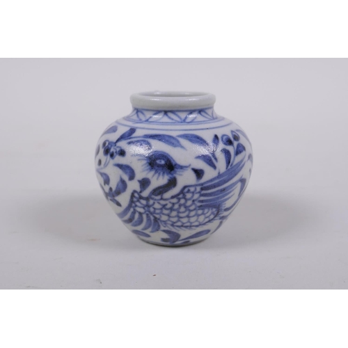 62 - An early Chinese miniature blue and white porcelain pot with phoenix decoration, possibly Yuan dynas... 