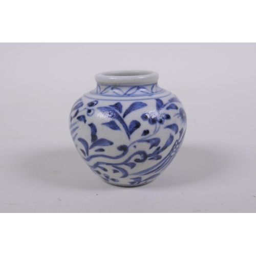 62 - An early Chinese miniature blue and white porcelain pot with phoenix decoration, possibly Yuan dynas... 