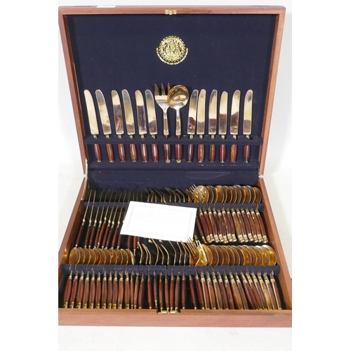 64 - A Thai bronze and rosewood twelve place cutlery set in wood canteen, appears unused